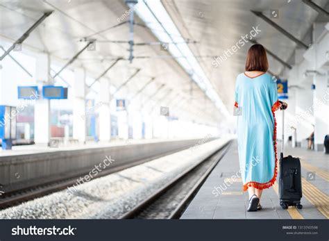 Traveler Women On Platform With Luggage And Belongings In The Railway Train Stationpassenger