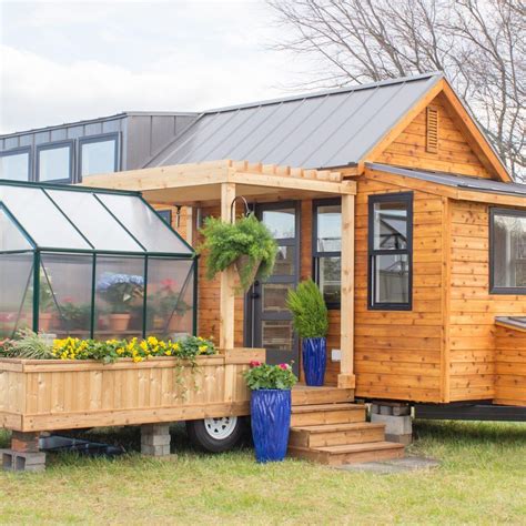 The Elsa Tiny House Has Greenhouse And Porch Swing Simplemost