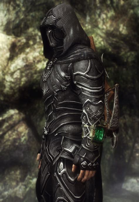 A Man Dressed In Armor And Holding A Green Jewel On His Left Hand With