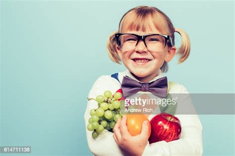 Young Nerd Girl Loves Eating Fruit High Res Stock Photo Getty Images
