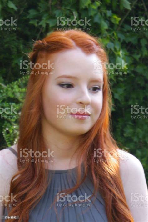 Image Of Red Haired Teenage Girl With Pale Skin And Freckles