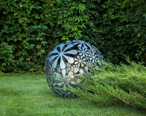Install three aa batteries (not included) and set the on/off. Hand welded metal garden sculpture Flower Ball a unique