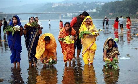 Devotees Offer Prayers To The Sun God After Taking Bath On Occasion Of