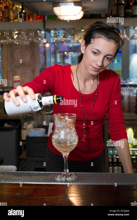 Female Bartender Pouring Drink At Bar Stock Photo Alamy