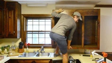 Throw away or donate the old cabinet doors, molding and hardware. Removing Some Kitchen Cabinets & Rehanging One | Kitchen cabinets, Beach house kitchens, Diy ...