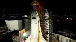 Space shuttle Endeavour hoisted upright for display