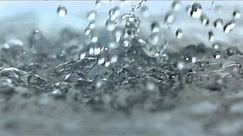 Rainfall Slow Motion HD Heavy Rain Drops Falling in Slow Mo Video View of Droplets Hitting Water