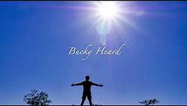 We Stand (words and music, by Bucky Heard, ©2020)