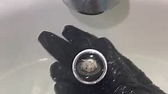 Person Thoroughly Cleans Bathroom Faucet
