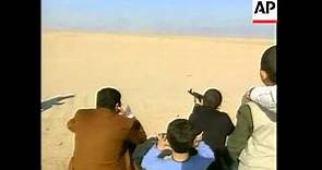 Video of Qusay teaching son to shoot