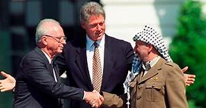 1993: Rabin and Arafat shake hands at White House with President Clinton
