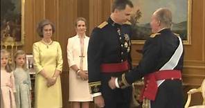 Spain's new king Felipe VI receives the royal sash