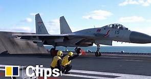 Chinese PLA Navy crew on the aircraft carrier Liaoning conduct training exercises