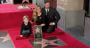 Amy Adams supported by family & Jeremy Renner at star ceremony