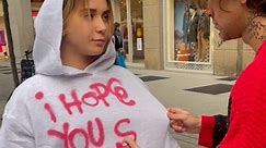 Guy sprays message on hoodie
