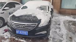 Car leaves behind frozen shell after thick front accumulated on its rear