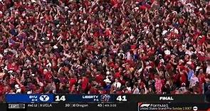 Liberty fans storm the field after beating BYU