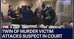 Twin of murder victim attacks suspect in court after seeing evidence video