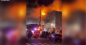 8 firefighters hurt as fire rips through 3 homes in Queens