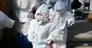 Footage shows children in Shanghai wearing HAZMAT SUITS amid brutal lockdown