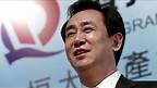 Evergrande boss sells stake to pay debts