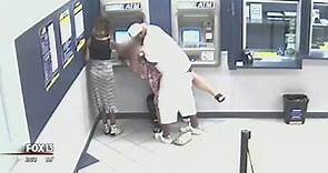 Customer looks on as man robs Tampa woman using ATM