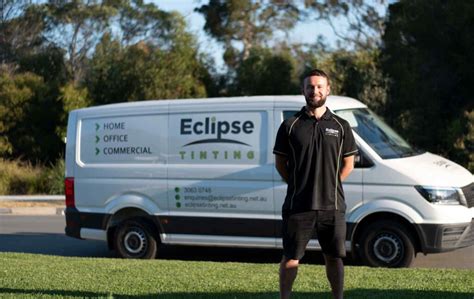 Image of a person researching reputable window tinting companies