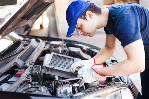 mechanic fixing engine
