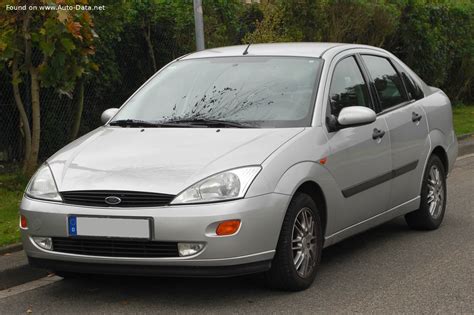 A clean 2001 Ford Focus sedan parked on a suburban street