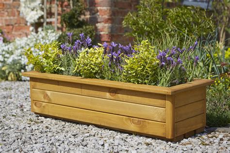 1. Add a trough planter for a compact and practical garden idea