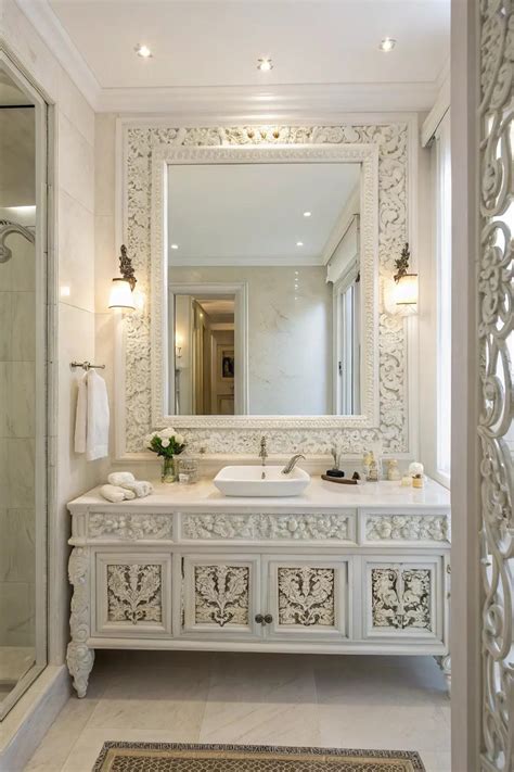 10. Add visual interest to a white bathroom with mirrors