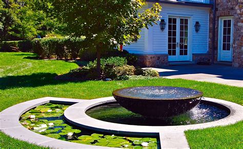 10. Complement backyard architecture with a stone bowl