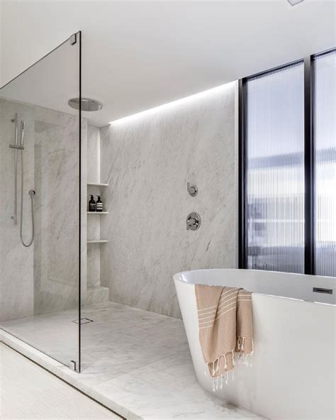 14. Use luxurious materials to create a statement walk-in shower