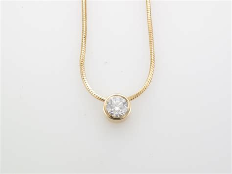 18 carat gold chain with diamond pendant