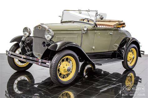 A pristine 1931 Ford Model A in a classic color, showcasing its iconic design