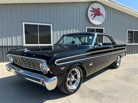 A classic 1964 Ford Falcon in pristine condition, showcasing its iconic design and appeal.
