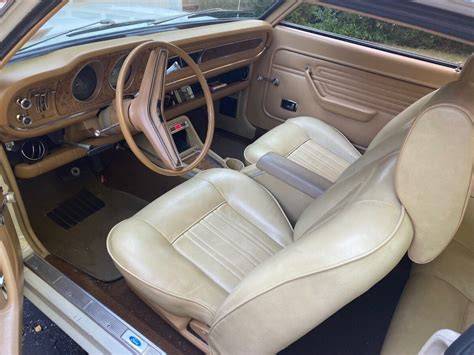 Interior view of a classic 1972 Ford Maverick dashboard and seats