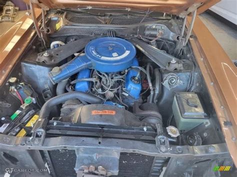 Close-up of the powerful V8 engine in a 1973 Ford Mustang for sale