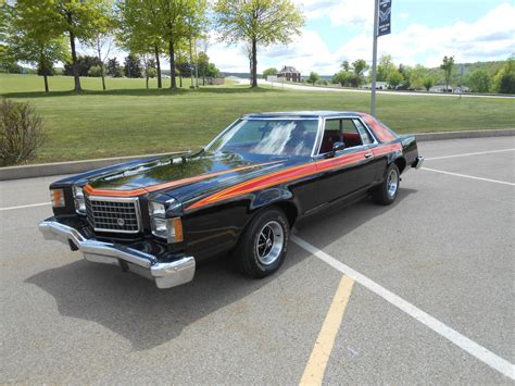 A classic 1979 Ford LTD parked on a sunny street, showcasing its full-size design and chrome accents.