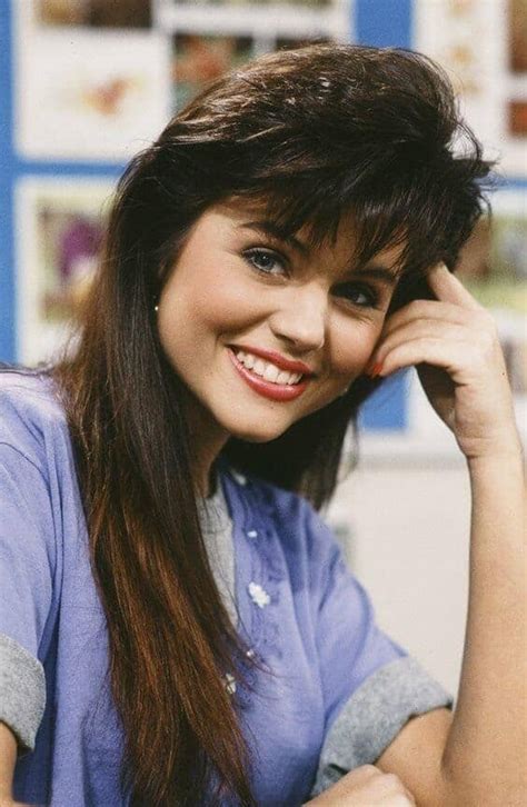 80s hairstyle with feathered bangs