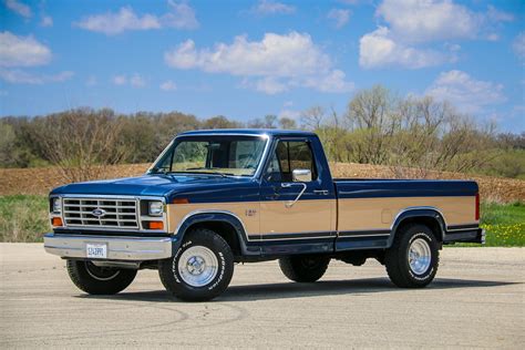 A classic 1986 Ford F-150 parked outdoors, showcasing its iconic design and sturdy build