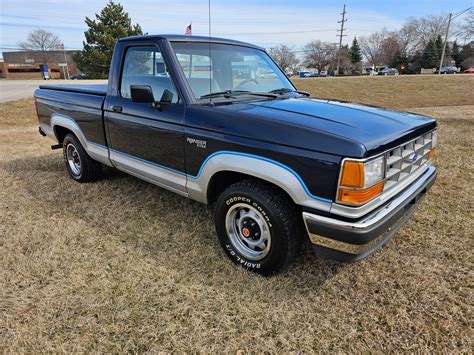 A classic 1989 Ford Ranger in pristine condition, showcasing its iconic design and compact pickup truck utility.
