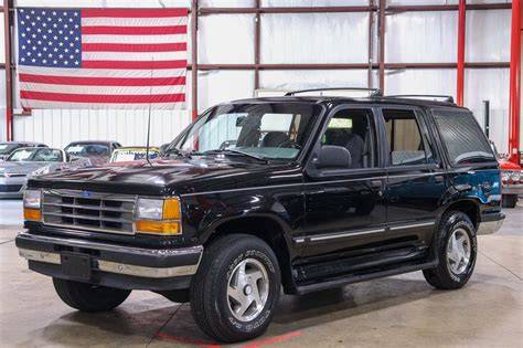A classic 1993 Ford Explorer parked outdoors, showcasing its iconic design
