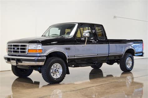 1997 Ford F250 XLT Crew Cab 4x4 in Dark Tourmaline Metallic A13259