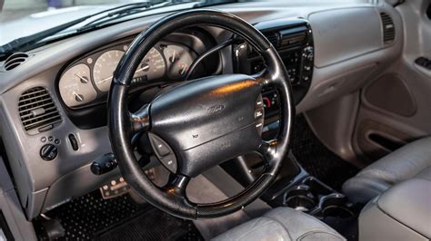 Interior view of a well-maintained 1998 Ford Explorer, showcasing its classic dashboard and comfortable seating.