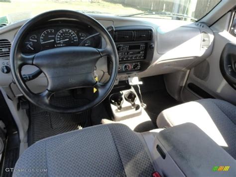 Dashboard of a 1999 Ford Ranger truck showing the steering wheel and instrument cluster