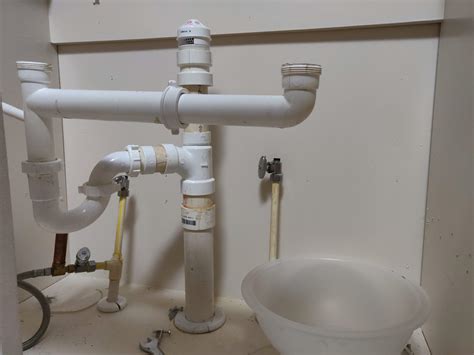 2 drain pipes under kitchen sink