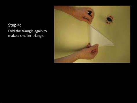 2. Fold your triangle in half again to make a smaller triangle