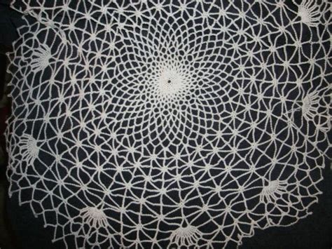 2. Use lace doilies to create a spider web effect