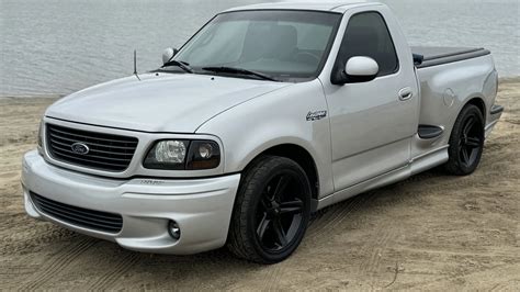 Modified 2002 Ford F-150 Lightning with custom wheels